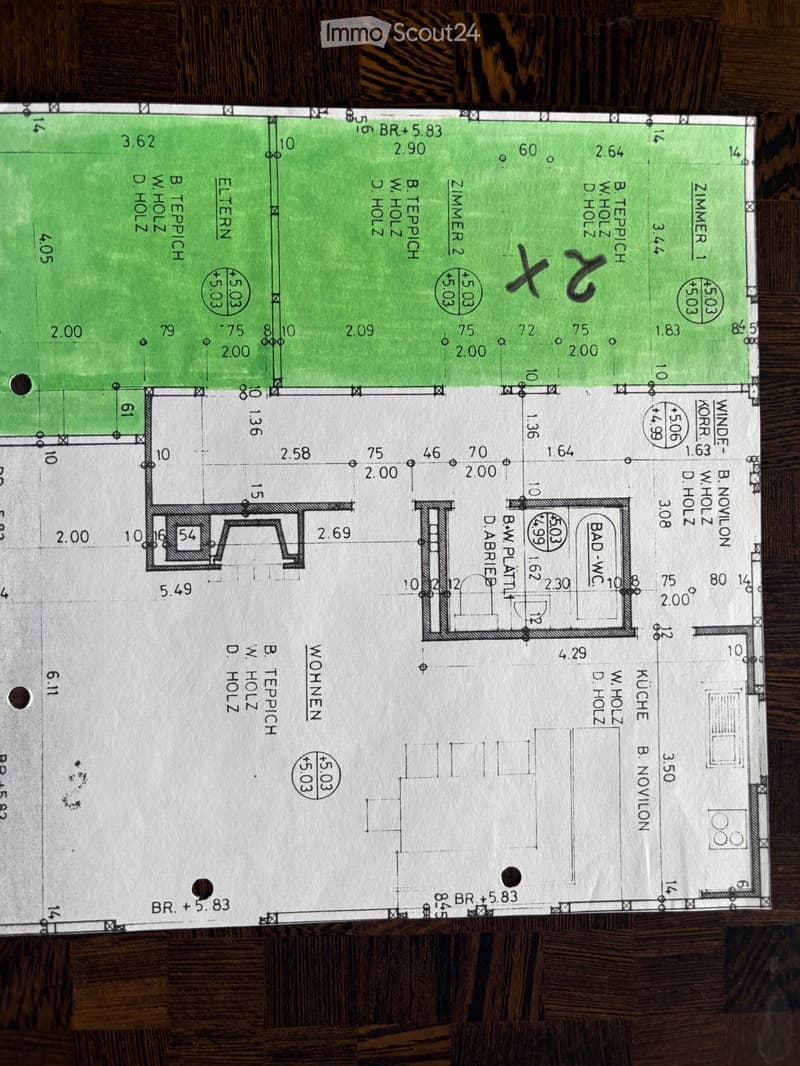 Floor plan of a residential space showing multiple rooms including a kitchen, living room, bedrooms, and bathrooms with labeled dimensions and room names.