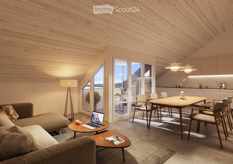 Modern living and dining area with a sofa, coffee table, laptop, dining table, chairs, floor lamp, and a small kitchen area with cabinets and a counter.