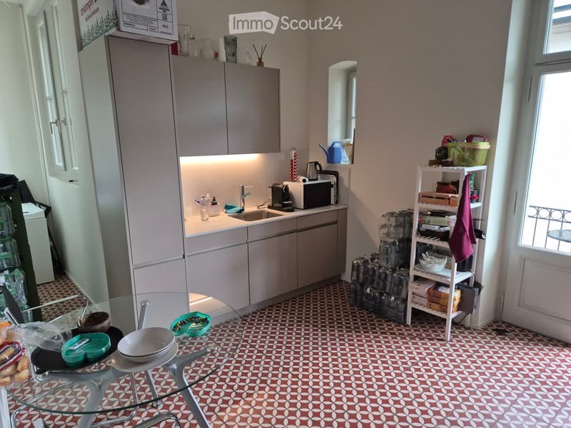 {"type": "Kitchen", "objects": ["refrigerator", "sink", "microwave", "coffee maker", "cupboard", "stool", "table", "cup", "bottle", "faucet", "shelf", "cupboard", "cupboard", "cupboard", "cupboard", "cupboard", "cupboard", "cupboard", "cupboard", "cupboar