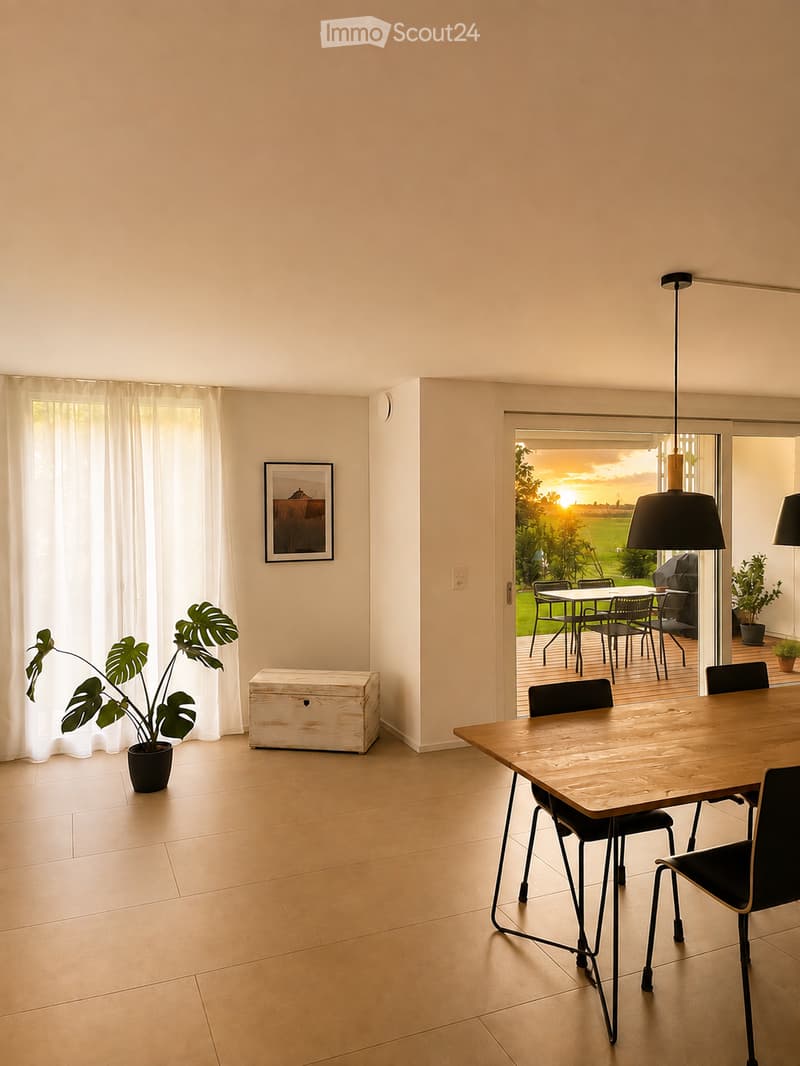 Bright dining area with a wooden dining table, black chairs, a potted plant, and a wooden chest, connected to an outdoor patio.