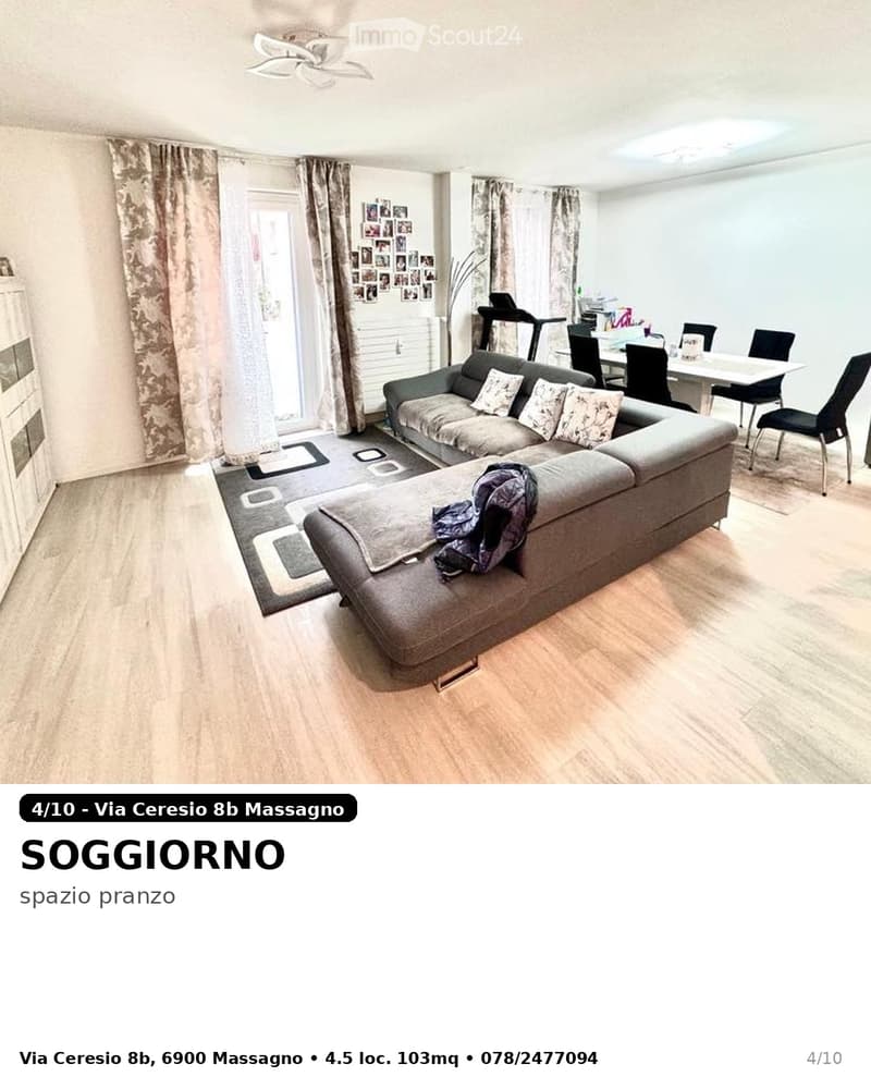 Living room with a grey sectional sofa, coffee table, dining area with chairs and table, laptop on a side table, large windows with curtains, and picture frames on the wall.