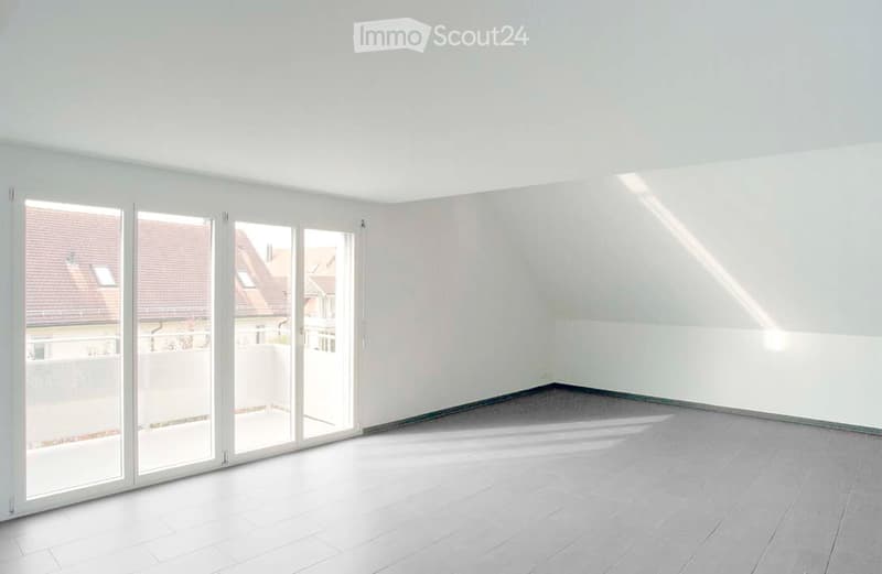 Empty room with white walls, large sliding glass doors, and a tiled floor. No furniture or equipment present.