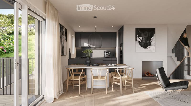 Dining area with fireplace, round table, chairs, and a view of the balcony and garden