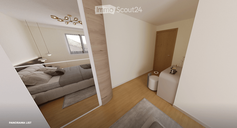 Modern bedroom with a large bed, nightstand, stool, and a mirror. The room features wooden flooring and a contemporary design.