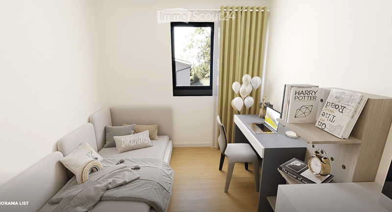 Cozy studio with a daybed, desk, laptop, chair, decorative balloons, and books.
