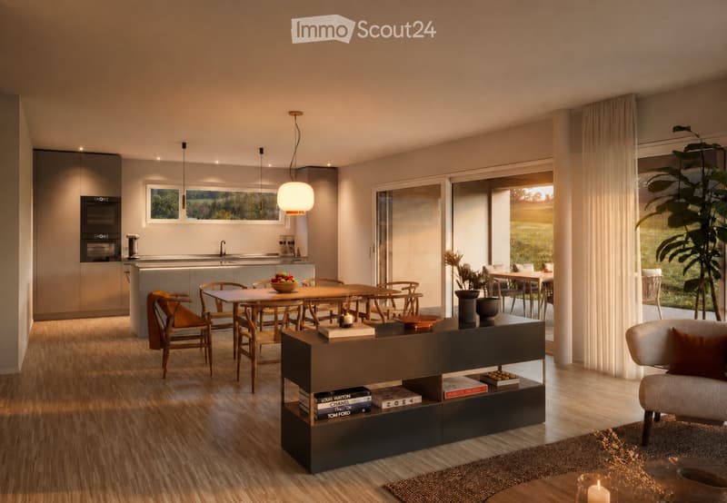 Modern open-plan living and dining area with wooden flooring, large windows, and a view of greenery. Features a sofa, dining table with chairs, bookshelf, and decorative items.