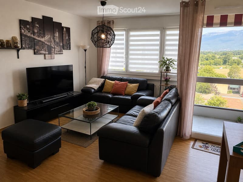 Modern living room with large windows offering a scenic view, featuring a black leather sectional sofa, glass coffee table, ottoman, floor lamp, TV stand, and decorative plants.