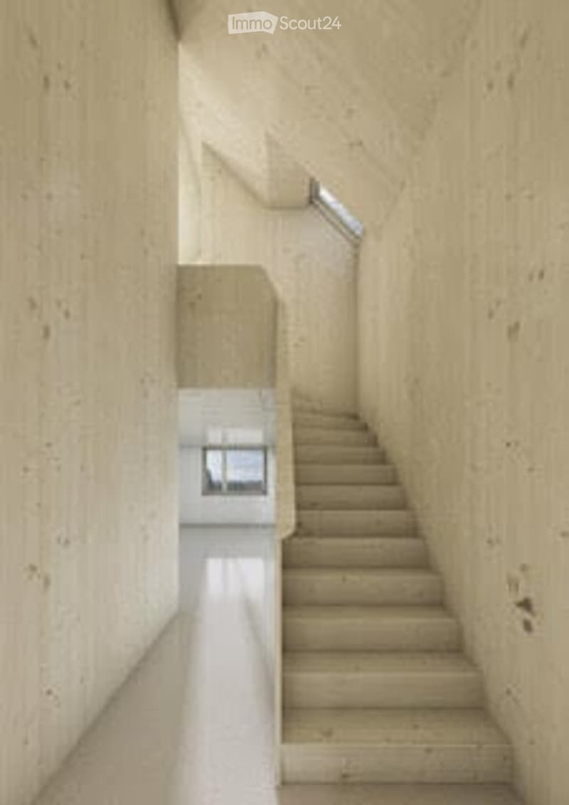 A modern, minimalist hallway with a staircase leading upwards, featuring clean lines and neutral tones.