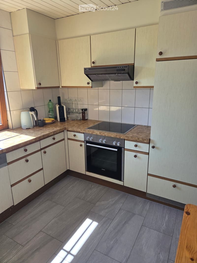 {"type": "Kitchen", "objects": ["oven", "induction cooktop", "range hood", "cabinets", "cupboard", "cup", "bottle", "cupboard", "cupboard", "cupboard", "cupboard", "cupboard", "cupboard", "cupboard", "cupboard", "cupboard", "cupboard", "cupboard", "cupboa