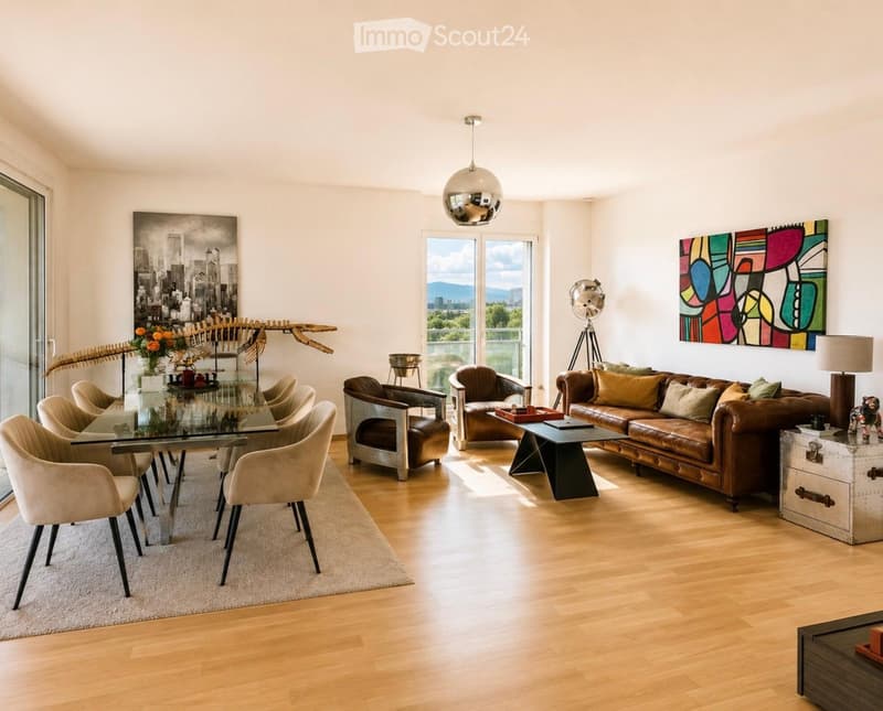 Modern living room with light wooden flooring, large windows, a brown leather sofa, glass coffee table, several chairs, and decorative art pieces.