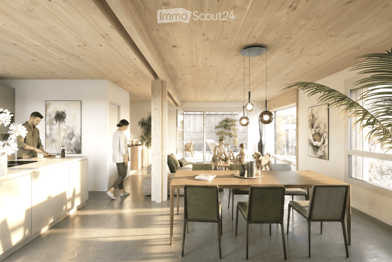 Open-plan living and dining area with wooden ceiling, large windows, dining table with chairs, sofa, coffee table, kitchen counter, pendant lights, and artwork on walls.