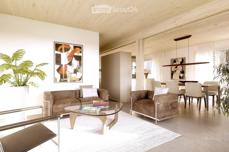 Modern living room with a beige sofa, armchair, glass coffee table, dining area with chairs and table, large potted plants, and artwork on the walls.