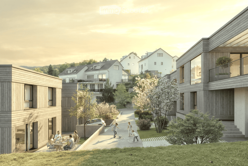 Modern residential complex with contemporary architecture, featuring multiple buildings with wooden facades and large windows, surrounded by greenery and pathways.