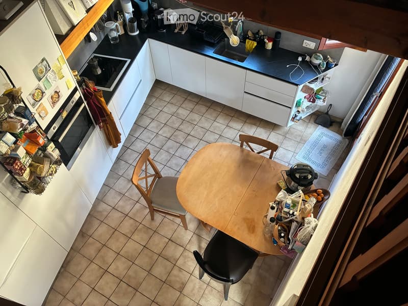 {"type": "Kitchen", "objects": ["refrigerator", "oven", "sink", "faucet", "cabinets", "table", "chair", "dishwasher", "microwave", "toaster", "cupboard", "oven mitts", "refrigerator magnets", "kitchen utensils", "kitchen towels", "kitchen counter", "kitch