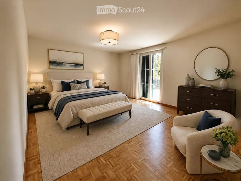 Modern bedroom with a large bed, nightstands, lamps, a bench at the foot of the bed, a round chair, a small table with a vase, and a large mirror on the wall.