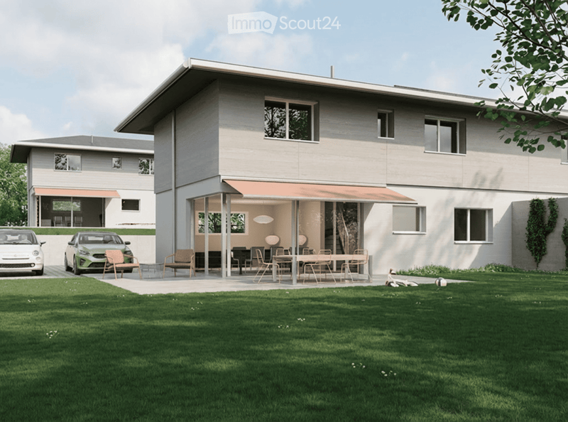 House. Modern two-story house with a covered outdoor seating area, lawn, and two parked cars.