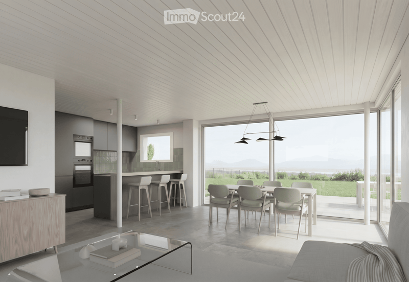 Furnished Room. Modern open-plan living and dining area with a view of the sea, featuring a sofa, coffee table, dining table with chairs, kitchen area with stools, and an oven.