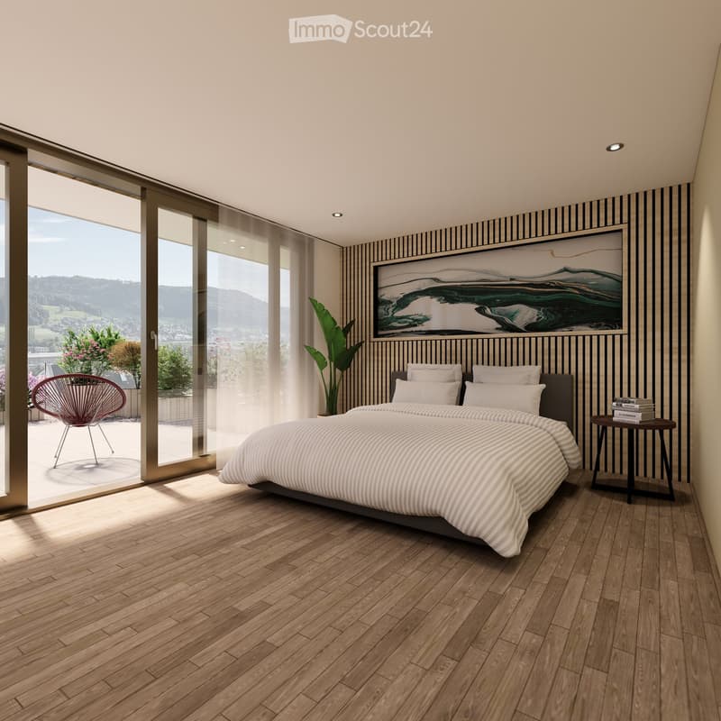 Modern bedroom with wooden flooring, large bed, nightstand, chair, plant, and a scenic view through large windows.