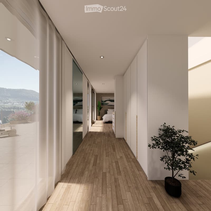 Modern hallway with wooden flooring, white walls, recessed lighting, and large windows offering a scenic view of the landscape.