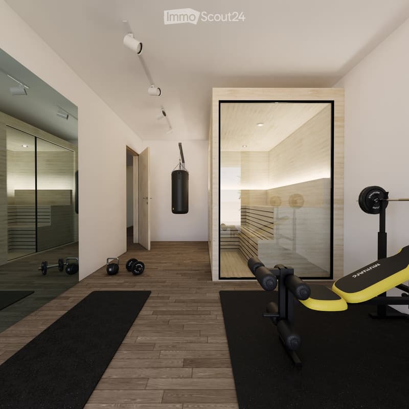 Modern home gym with wooden flooring, large mirror, dumbbells, punching bag, weight bench, and weight machine.