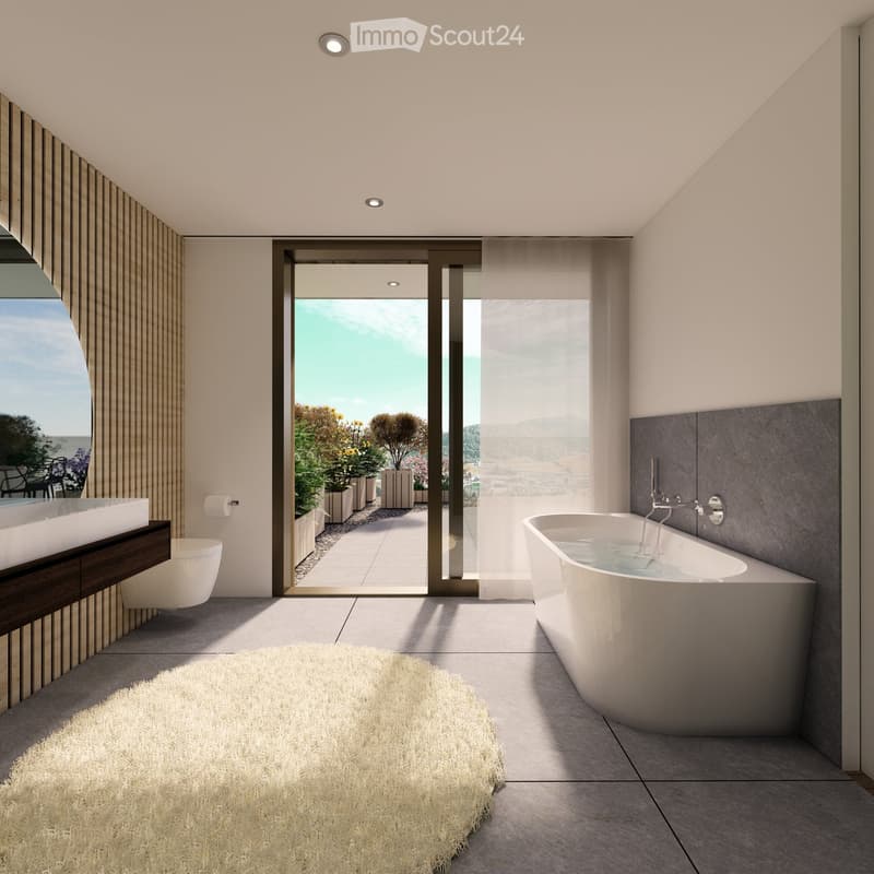 Modern bathroom with a freestanding bathtub, toilet, sink, and a large window offering a scenic view of the landscape.
