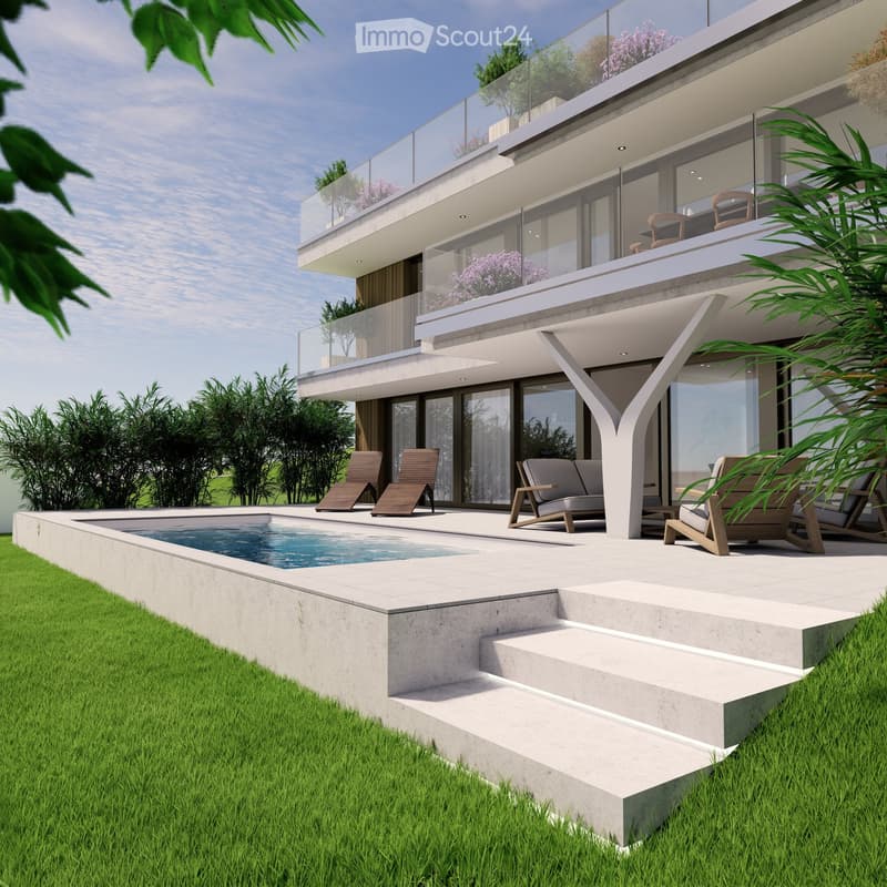 Modern house exterior with a swimming pool, lounge chairs, and a balcony with glass railings. The house features large windows and a contemporary design with a raised ground floor.