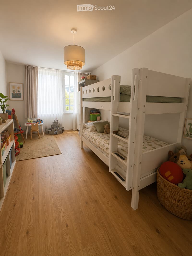 Bright, child-friendly bedroom with a white bunk bed, wooden floor, large window with curtains, and various toys and furniture.
