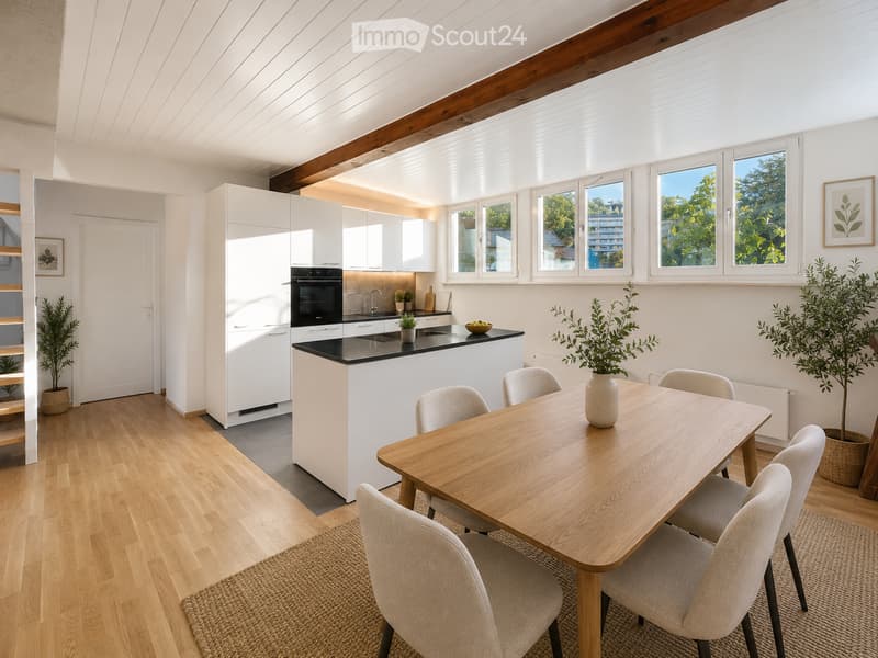Bright, modern kitchen with white cabinets, black countertop, and a wooden dining table with six chairs. The space features large windows with a view of greenery, a built-in oven, and a sink with a faucet. Potted plants and a vase on the table add a touch