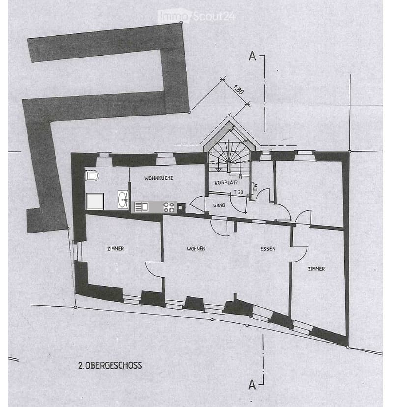 Floor plan of the second upper floor showing a kitchen, living area, dining area, hallway, and two bedrooms.