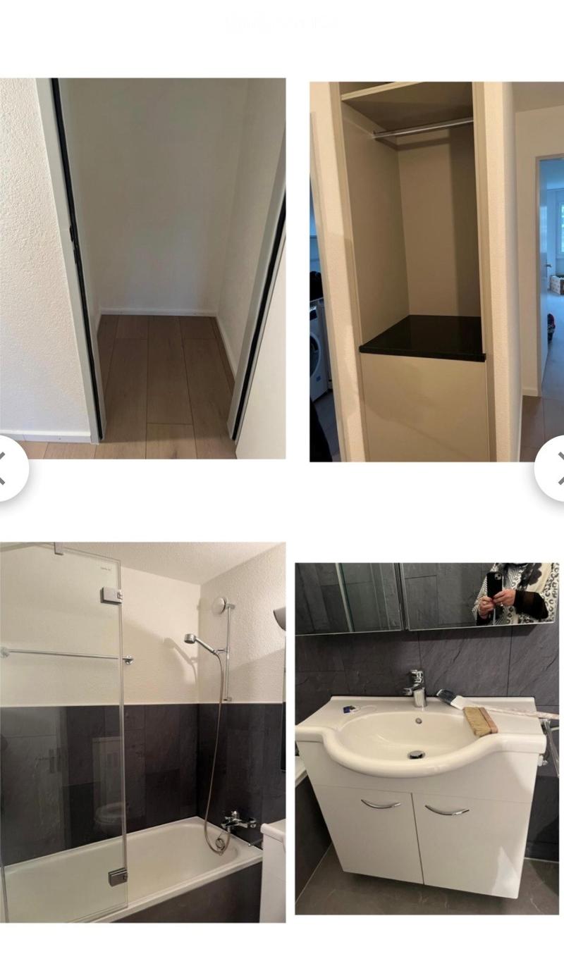Bathroom with a bathtub, shower, sink, mirror, and cabinet. The space is clean and modern with tiled walls and a glass shower enclosure.