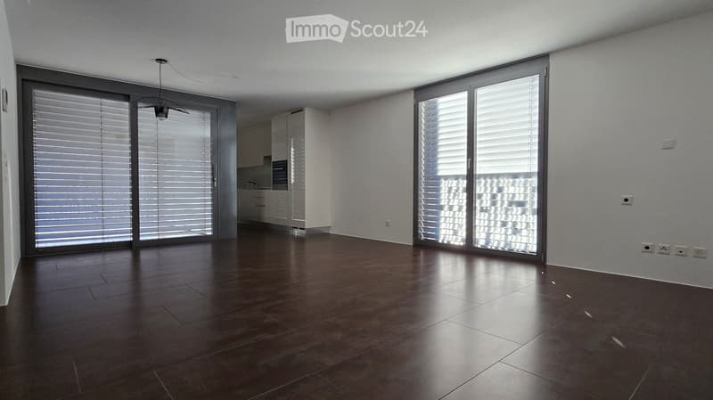 dark wood floor, sliding glass doors, tall windows, open to balcony