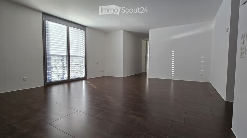 modern empty room with tiled floor, glass doors, white walls, view to outside