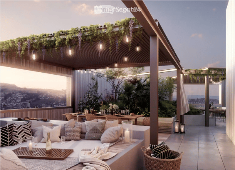 A modern rooftop terrace with a lounge area, dining area, and lush greenery, offering a scenic city view.