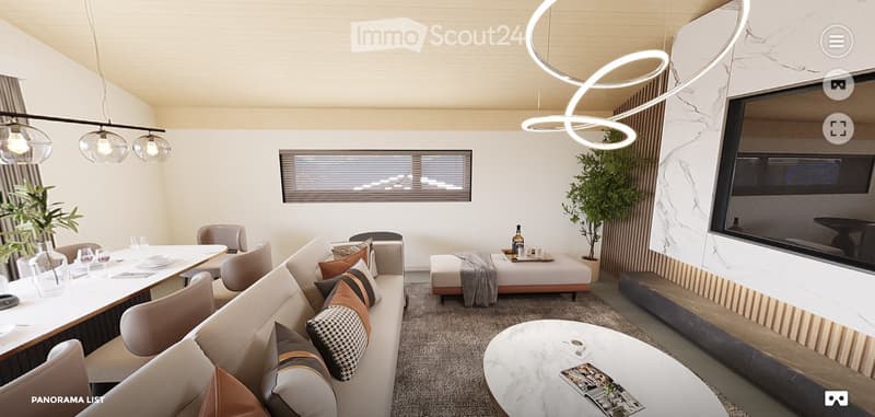 Modern living room with a large sectional sofa, coffee table, dining area, and decorative lighting.
