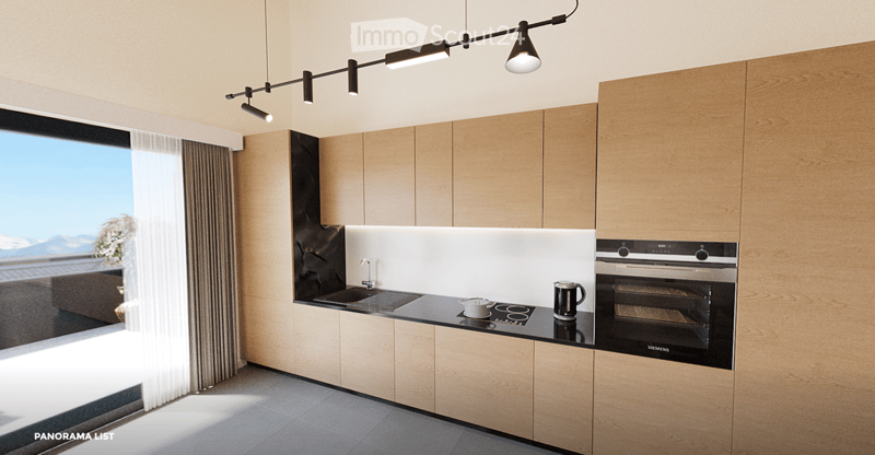 Modern kitchen with light wood cabinets, stainless steel appliances, and a sleek countertop. Features a built-in oven, sink, and a view of the outdoors.