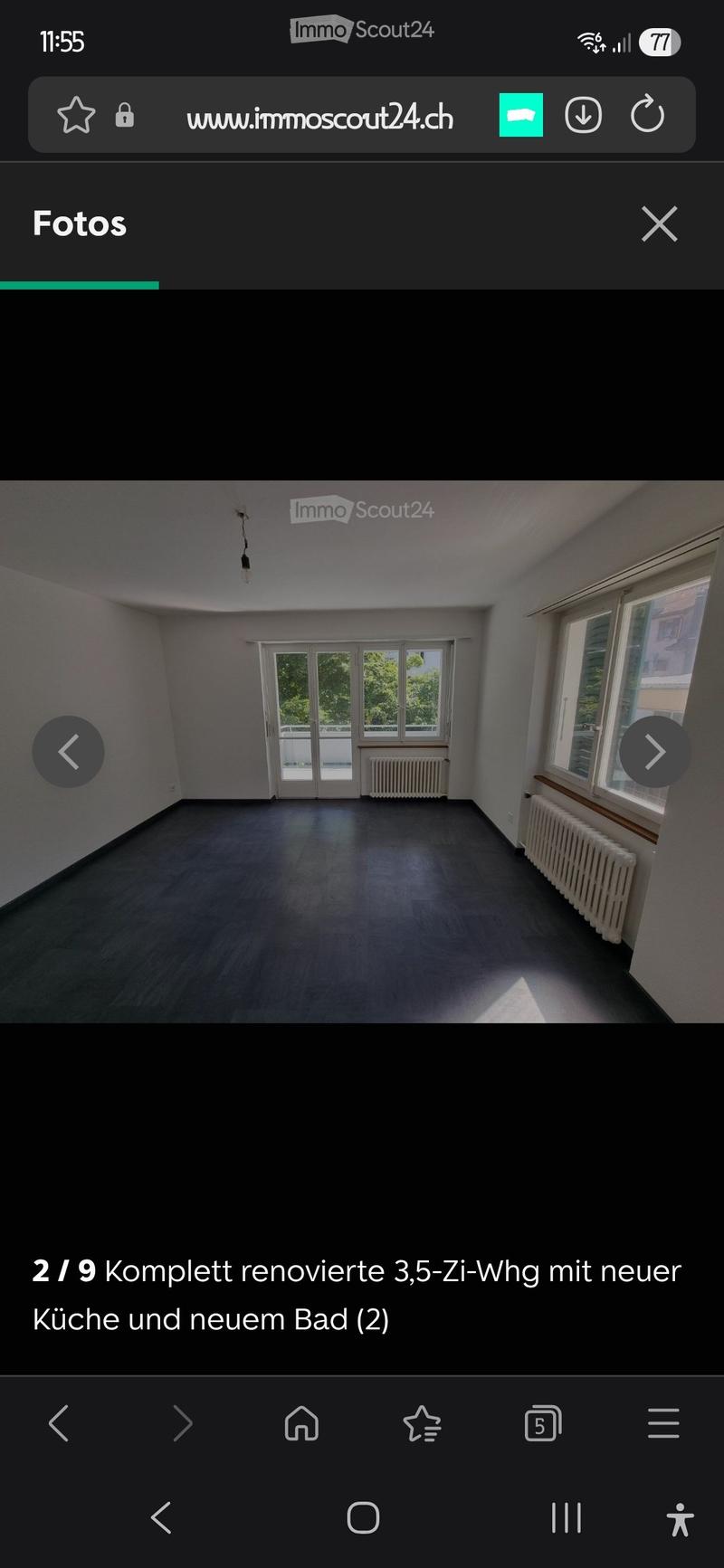 Empty room with wooden flooring, white walls, large windows, and a radiator. No furniture or equipment present.