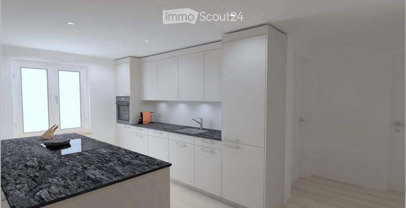 Modern kitchen with white cabinets, granite countertop, built-in oven, sink, and small appliances.