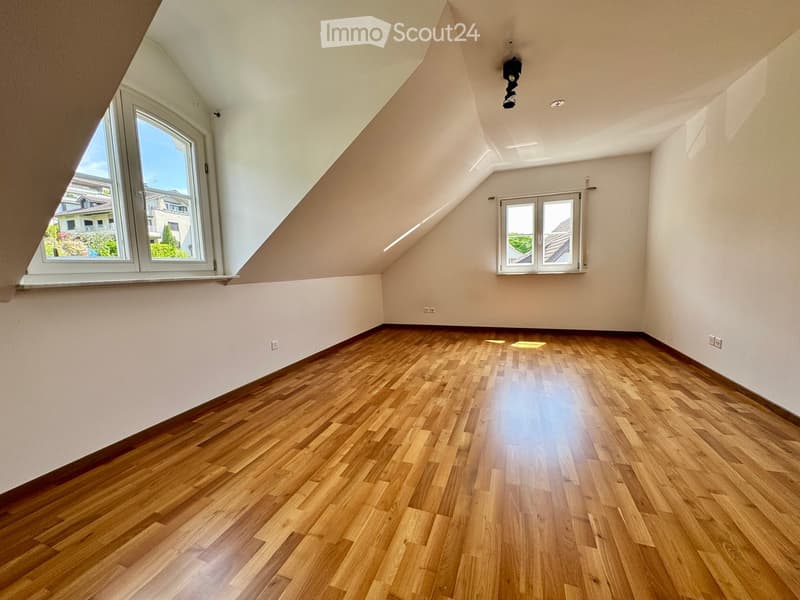 empty room, wooden floor, slanted ceiling, two windows