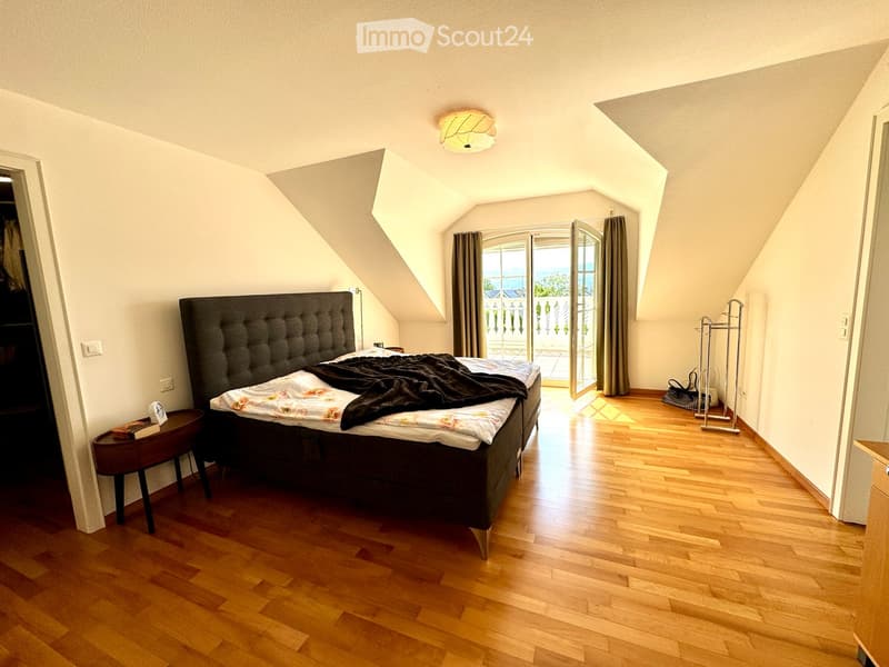 Double bed, nightstand, window with curtains, balcony with view