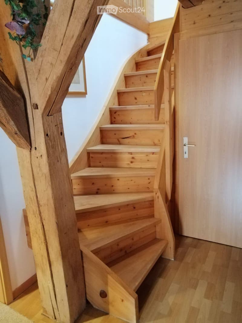Wooden stairs, wooden pillars, hardwood floor, wooden door