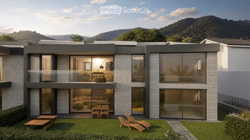 Modern two-story house with large glass windows and a spacious outdoor area featuring lounge chairs and a small table.
