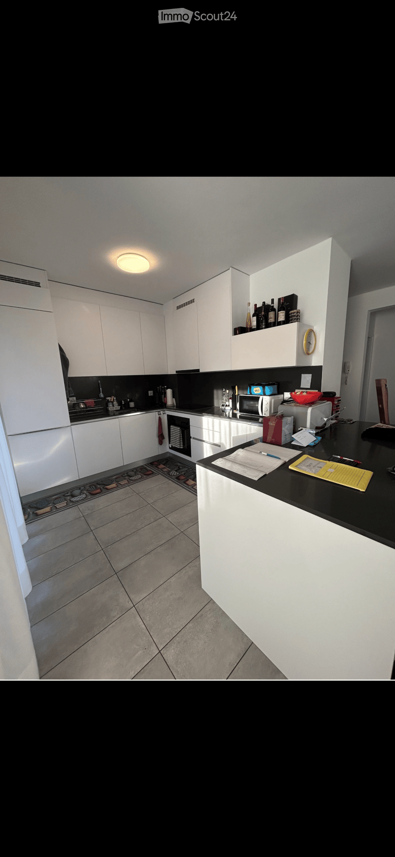 {"type": "Kitchen", "objects": ["refrigerator", "oven", "microwave", "countertop", "cabinet", "bottle", "bowl", "oven mitt", "oven", "oven", "oven", "oven", "oven", "oven", "oven", "oven", "oven", "oven", "oven", "oven", "oven", "oven", "oven", "oven", "o