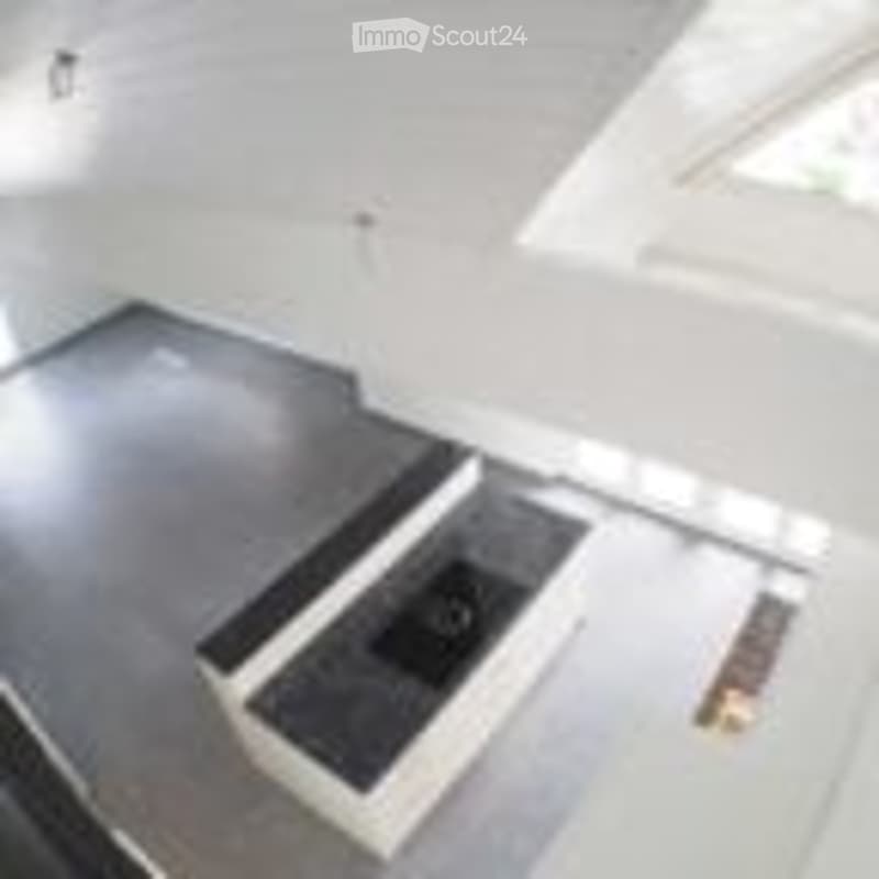 Completely empty room with a concrete floor and white walls. No furniture or equipment is present.