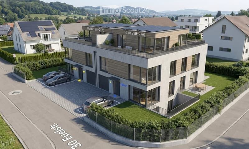 Modern two-story building with solar panels on the roof, labeled 'Haus 1' and 'Haus 2', featuring a garage and parking area.