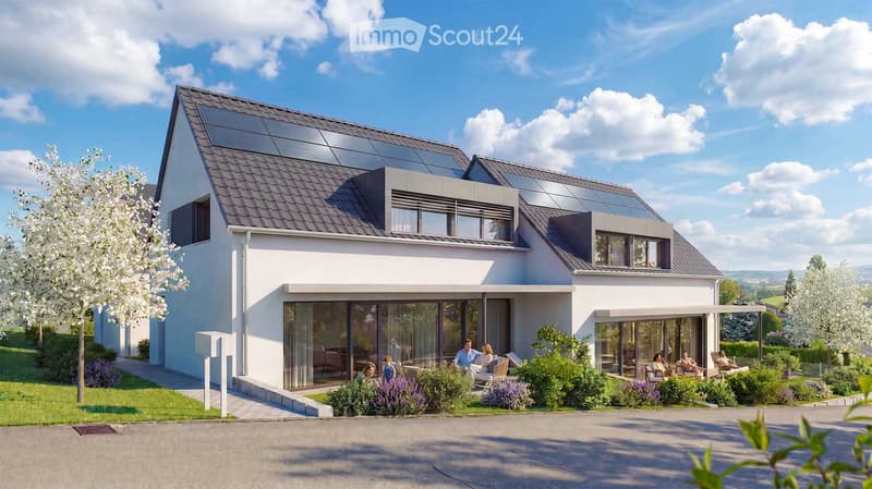 Modern two-story house with solar panels on the roof, large windows, and a spacious garden area with seating and greenery.