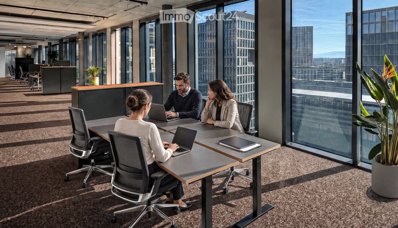 Modern office space with large windows, three people working at a table with laptops, ergonomic chairs, and potted plants.