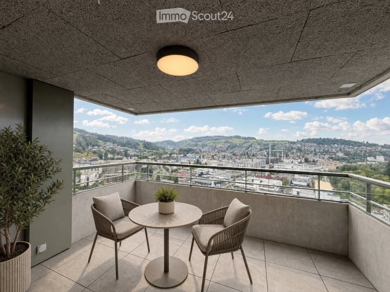Modern balcony with round table, two chairs, potted plants, and expansive city view.