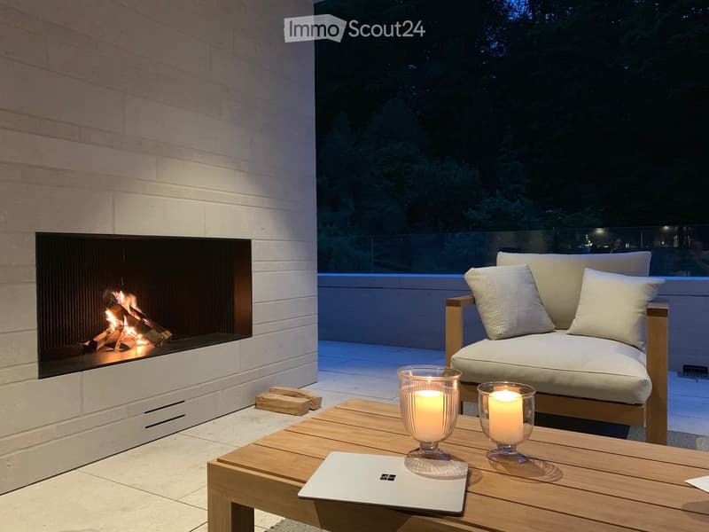 Fireplace, sofa, table, candles, laptop, tiles floor