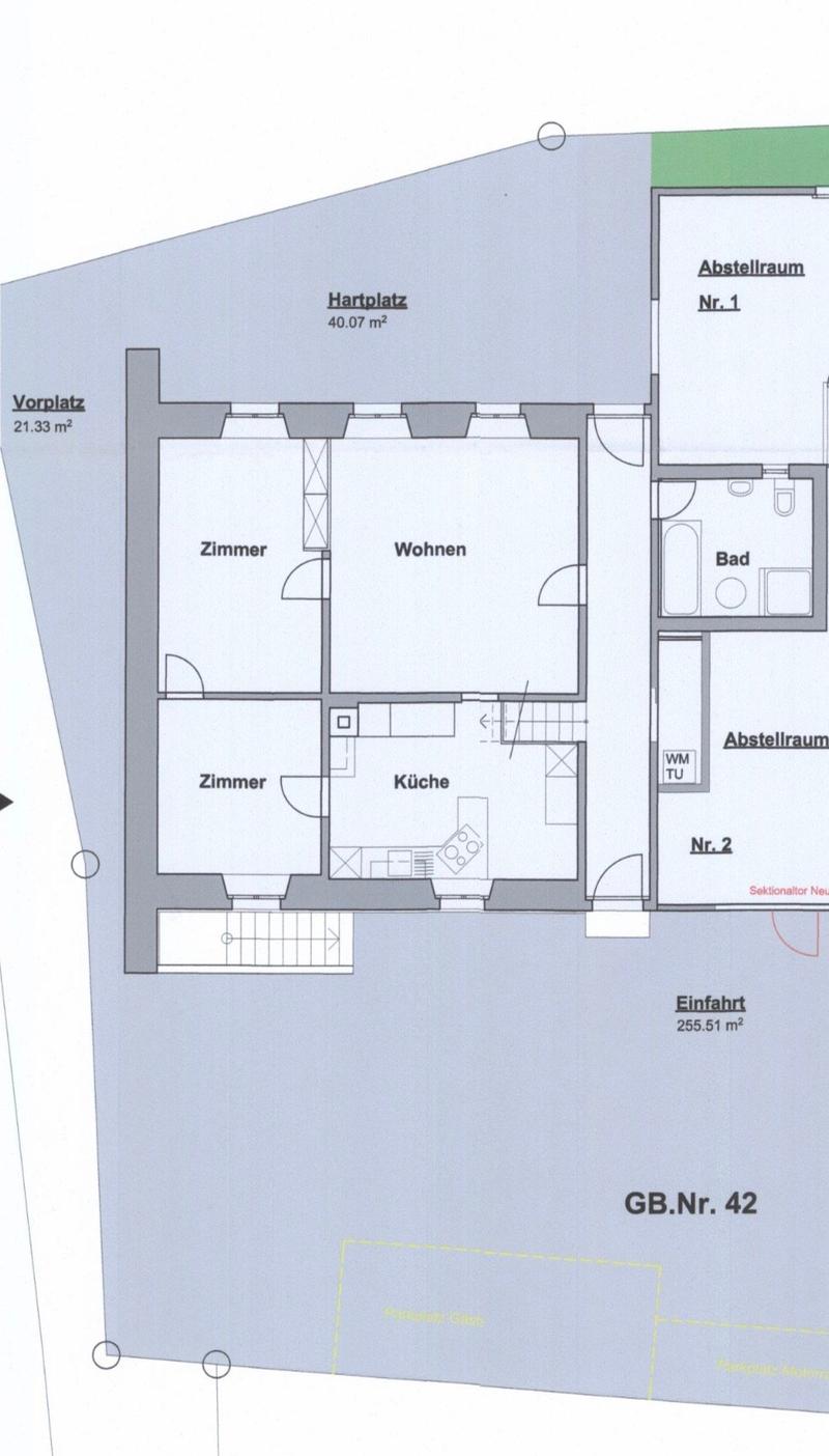 Floor plan showing a layout with a living area, two bedrooms, kitchen, bathroom, storage rooms, entrance area, and parking space.