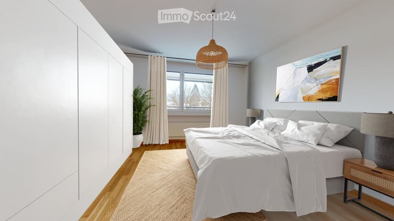 Modern bedroom with a large bed, nightstand, lamp, painting, plant, and wardrobe. Light-colored decor with wooden flooring.